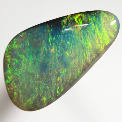 SOLID SEMI BLACK OPAL Bright sparkles of orange and green in an Iris pattern